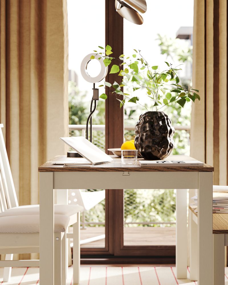 An ÅLHULT extendable table, with a bench and two chairs, is placed next to a sliding door that leads to a sunny backyard.