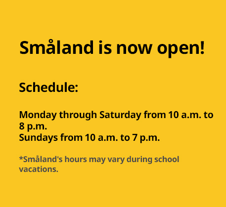 Yellow sign announcing the opening of Småland with operating hours from Monday to Sunday.