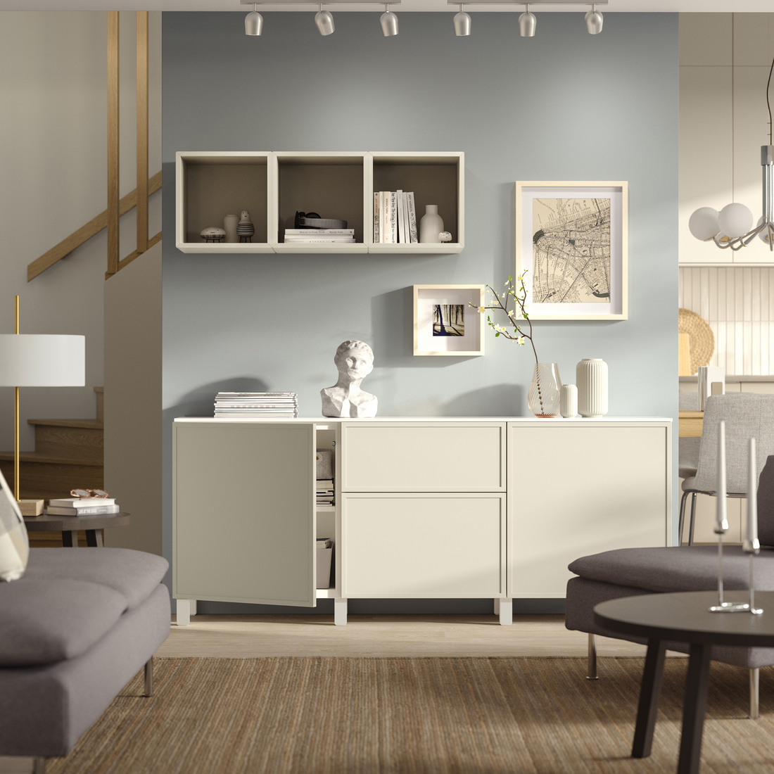 Beige sideboard cabinet and floating wall shelves in a modern neutral-toned living room.