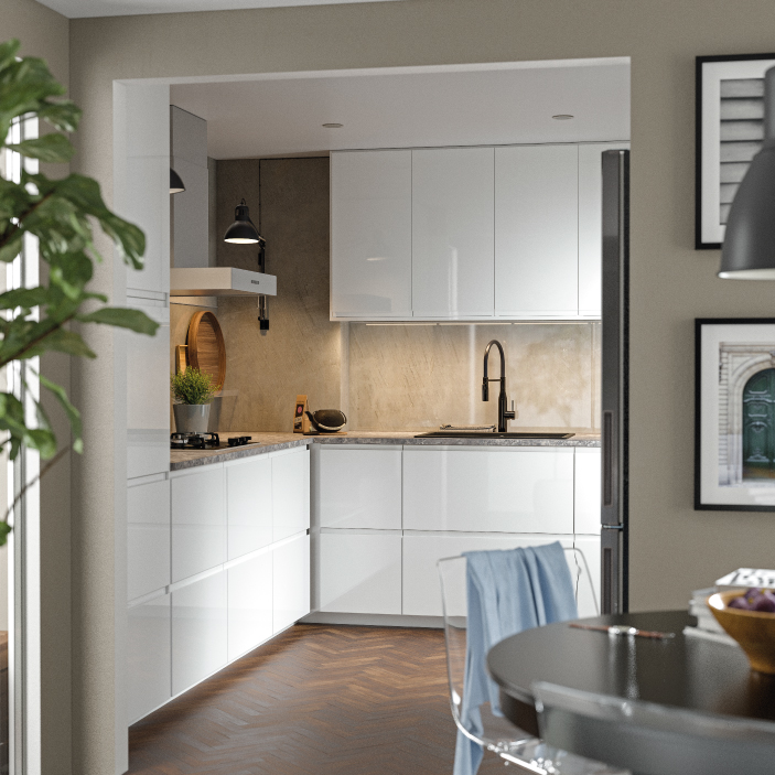 Cocina moderna con gabinetes blancos y diseño minimalista.